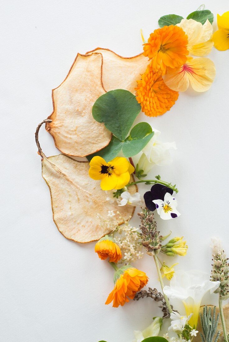 Various edible flowers and dried pear chips