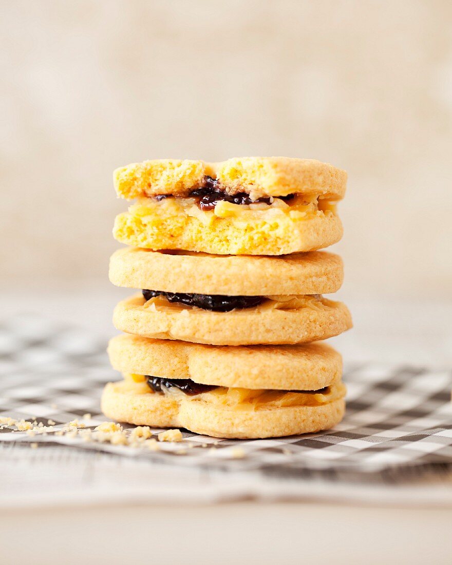 A stack of cream and jam sandwich biscuits