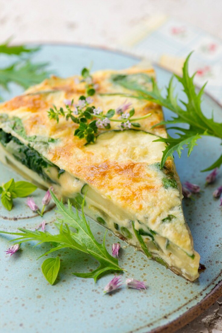 A slice of potato frittata with herbs