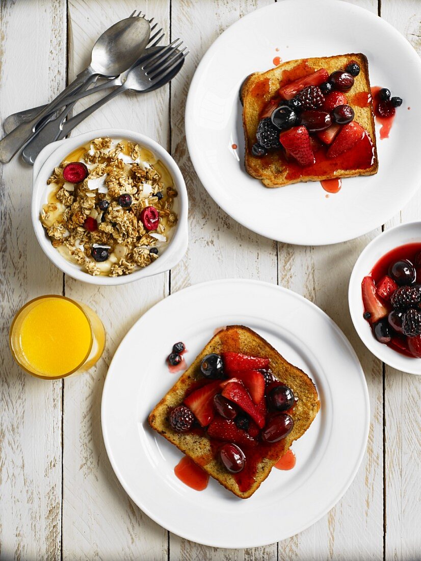Spicy berries toast, muesli and orange juice for breakfast