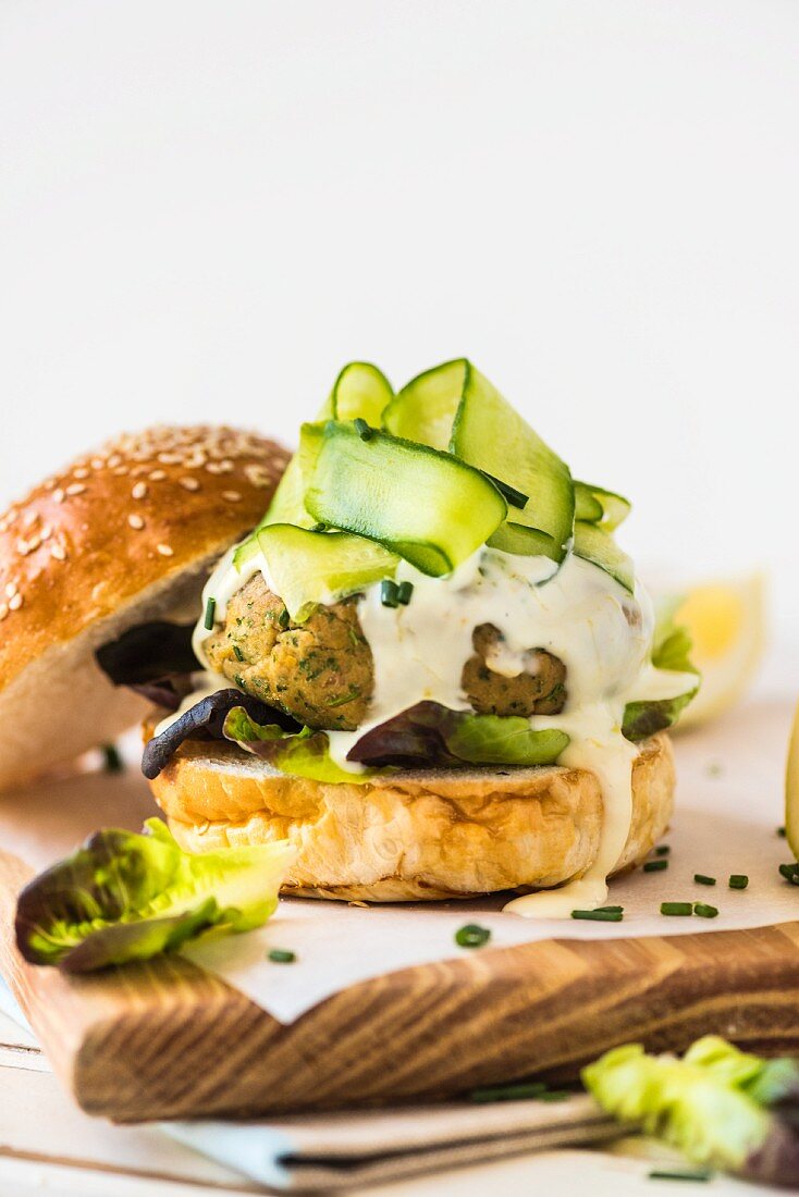 Tuna fish chickpea burger with lemon mayonnaise and cucumber strips