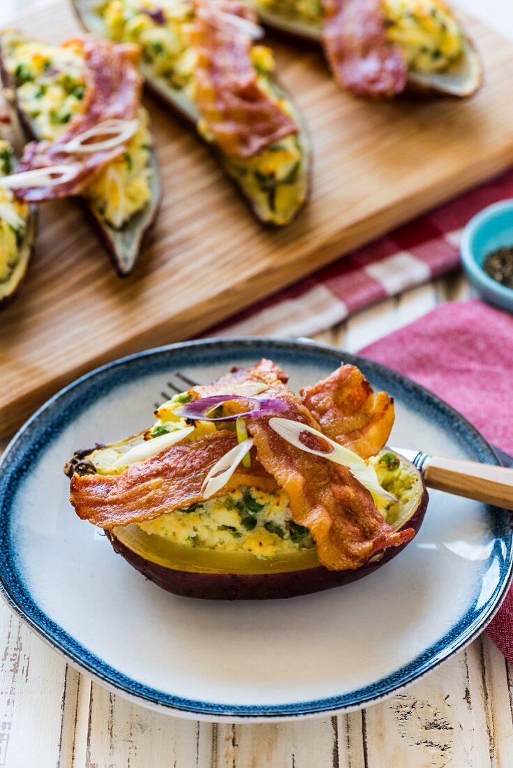 Stuffed sweet potatoes with bacon and onions