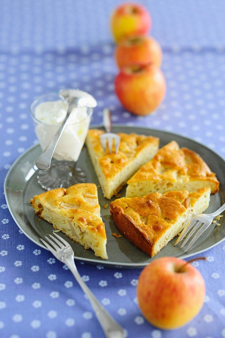Slices of apple cake with cream