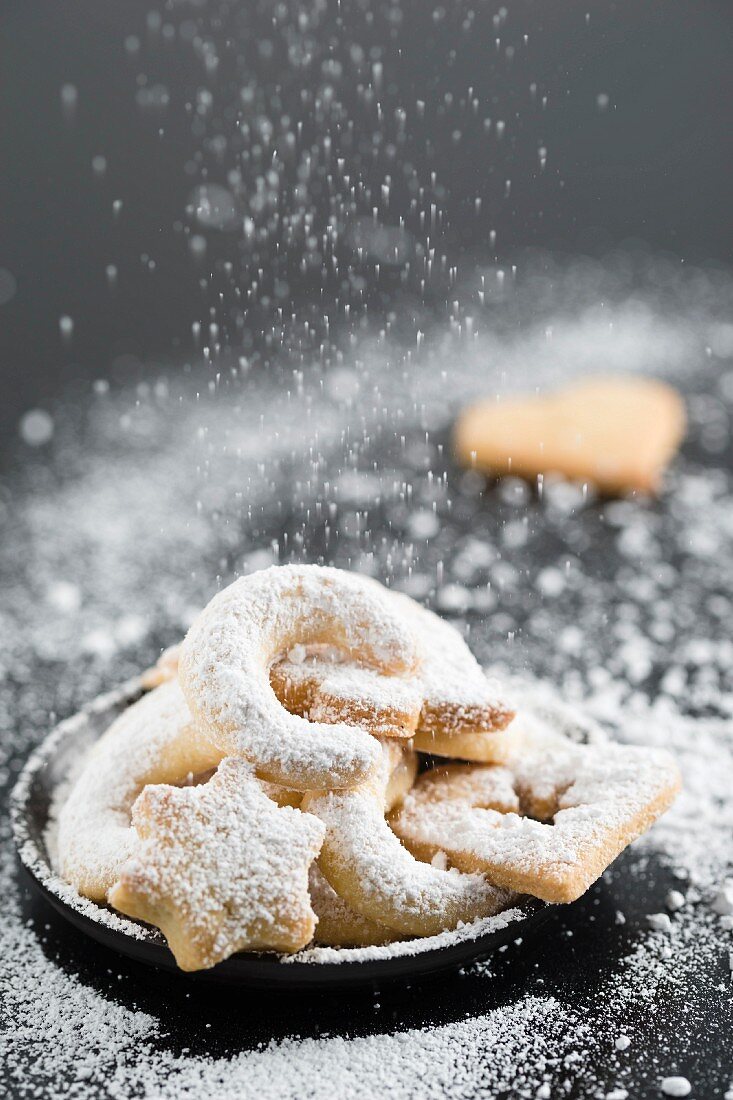 A selection of biscuits with icing sugar