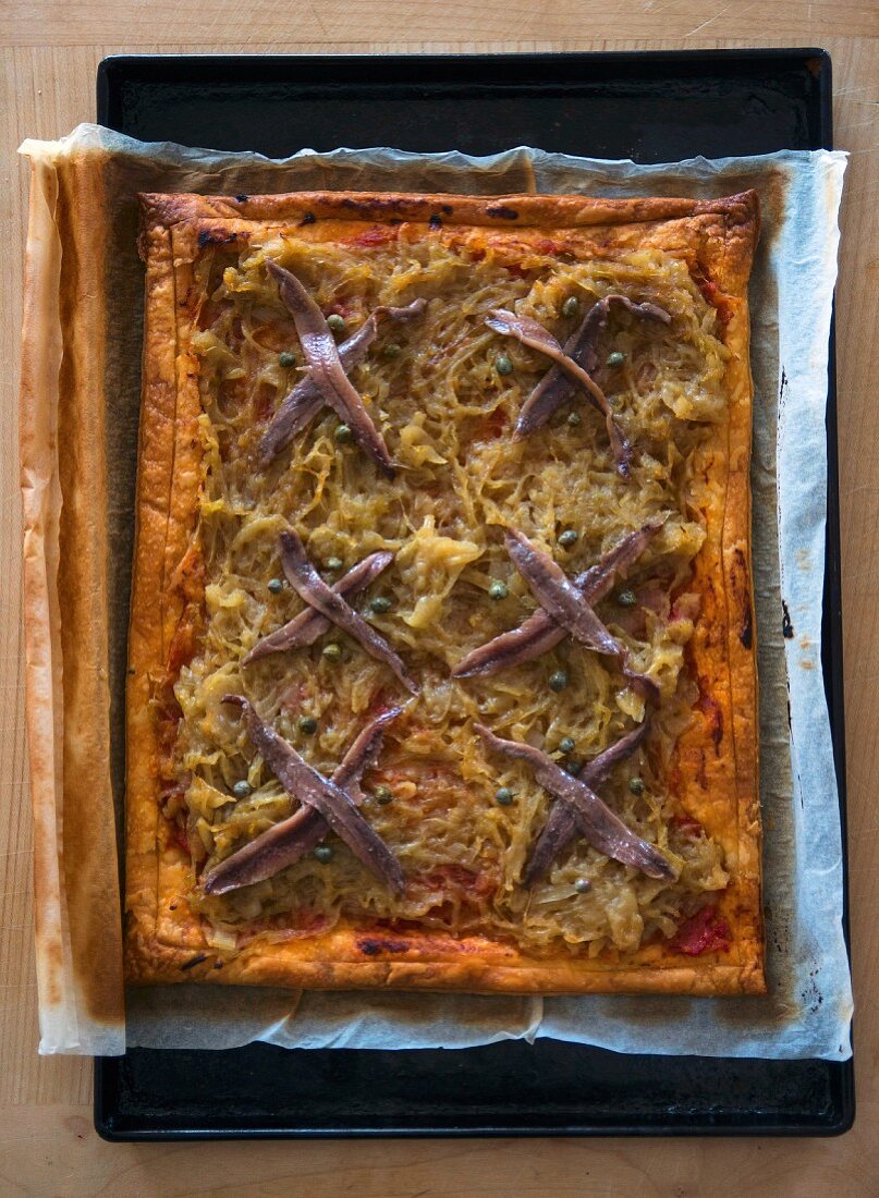 Pissaladiere on a baking tray