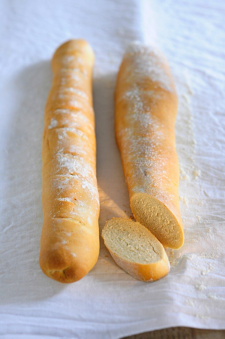 Two baguettes, one sliced