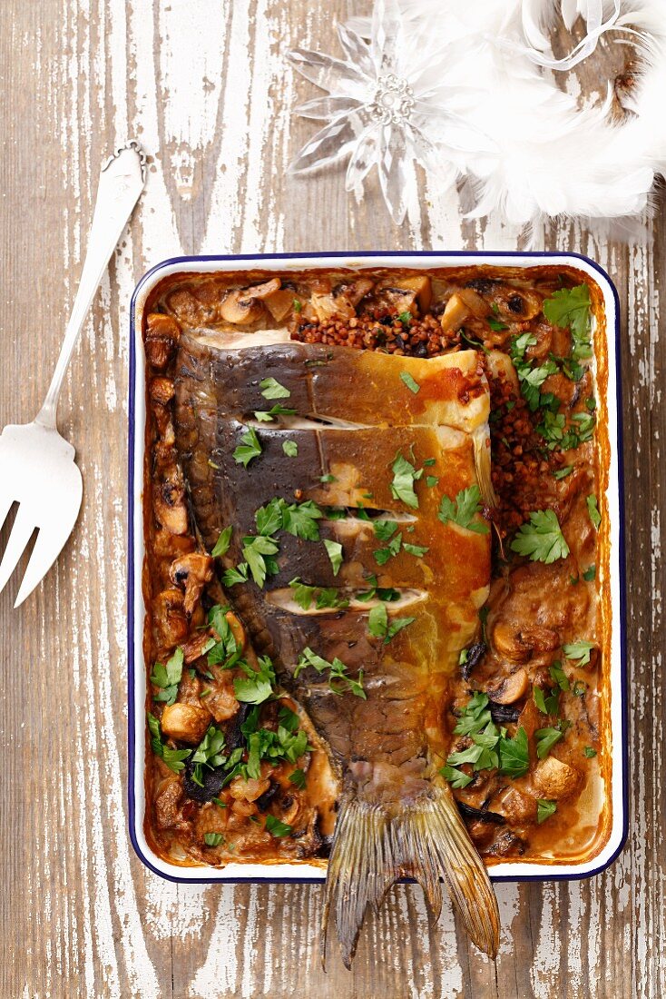 Baked carp stuffed with buckwheat and mushrooms for Christmas