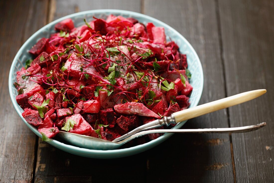 Herring with beetroot, potatoes, cream and beetroot sprouts