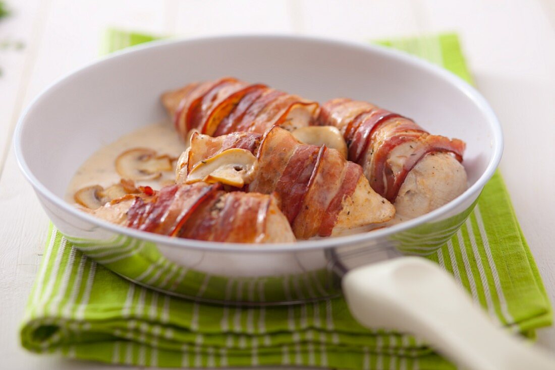Stuffed chicken breast wrapped in bacon with mushrooms