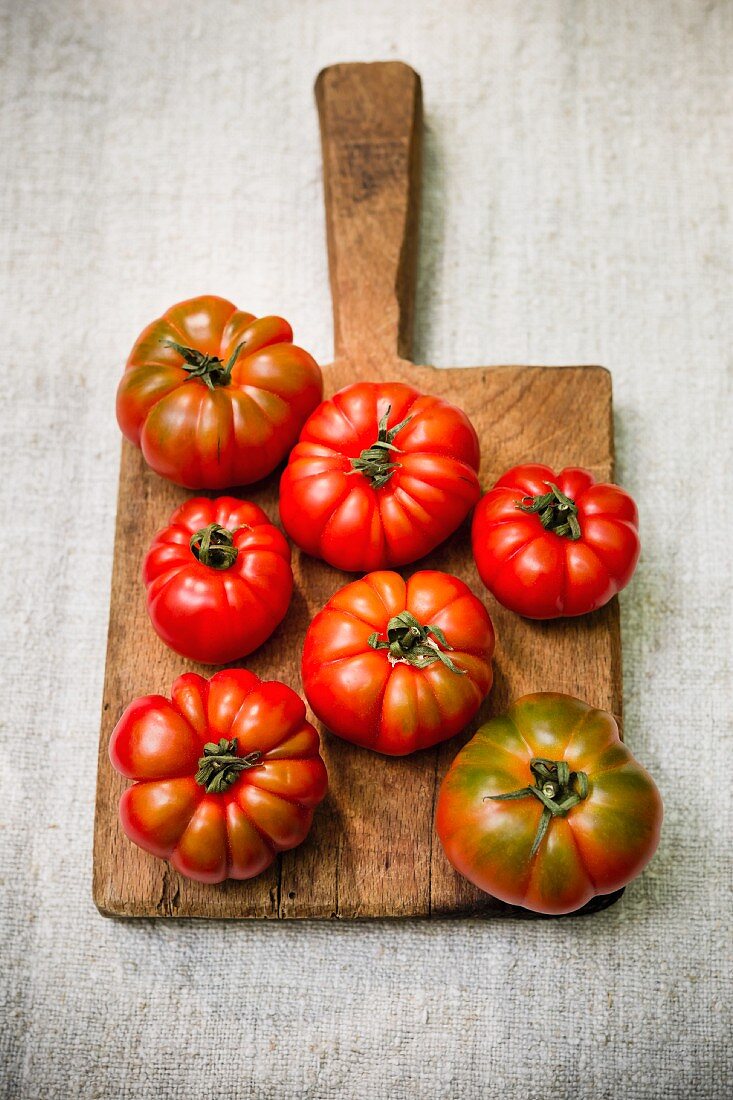 Fresh tomatoes on a wooden board