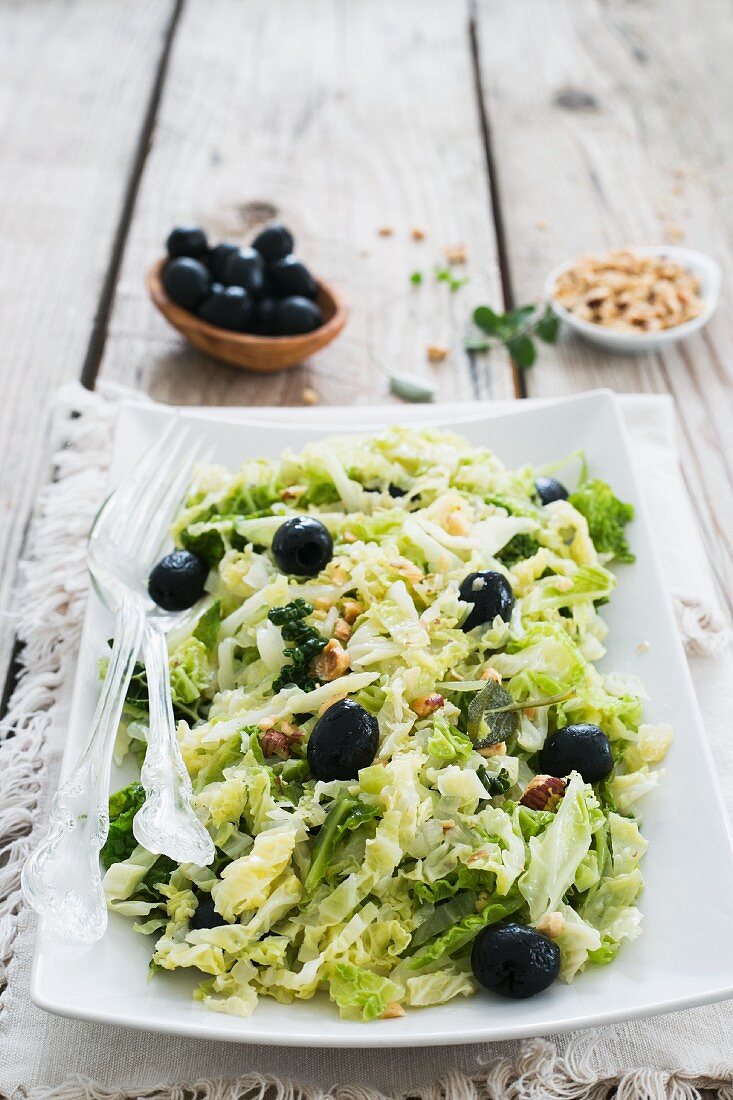Savoy cabbage salad with black olives and hazelnuts