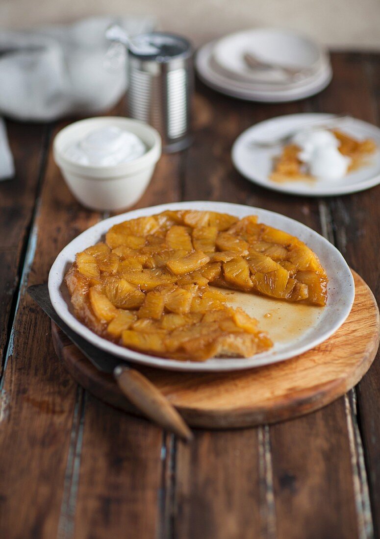 Tarte Tatin with pineapple on a wooden table