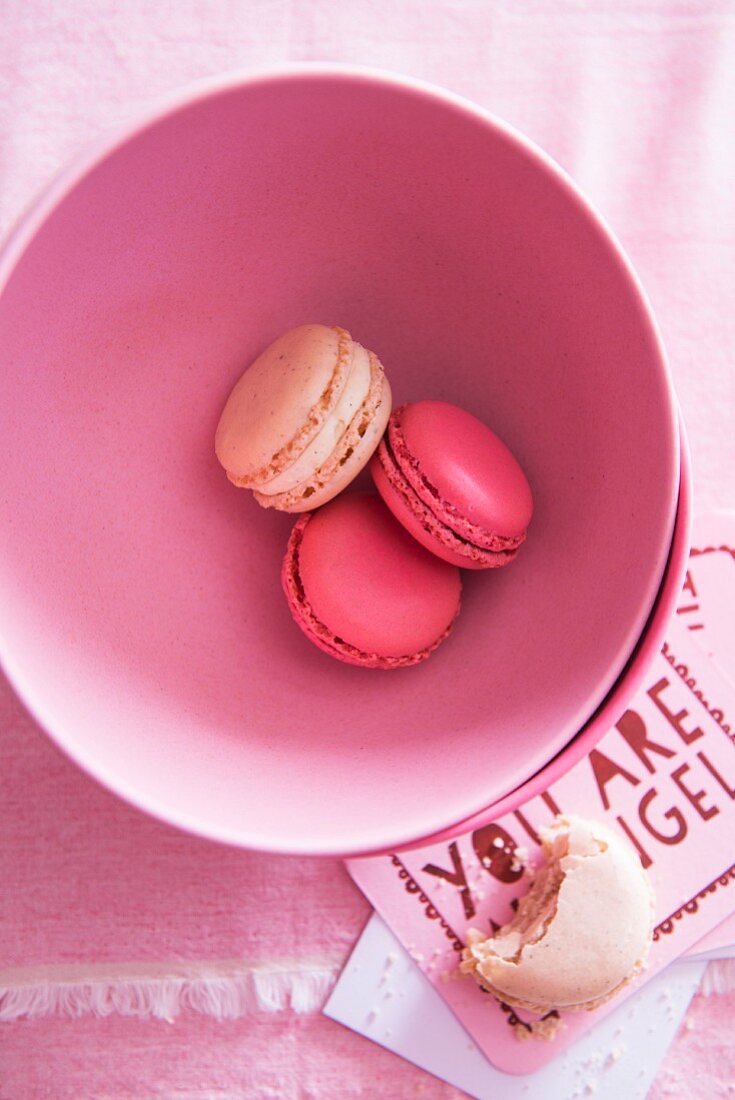 Pink macaroons in a bowl