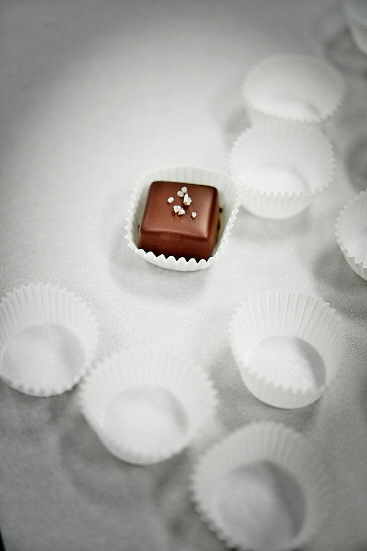 Chocolate-covered caramel sweet with sea salt
