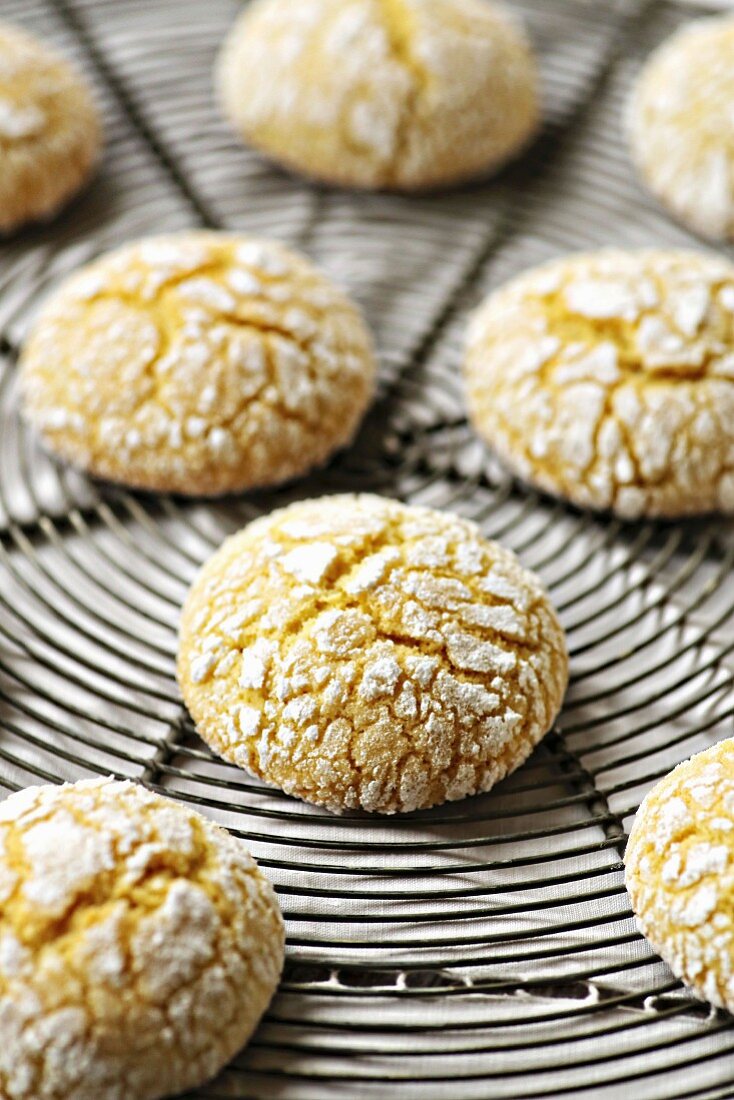 Lemon crinkle cookies on a wire rack