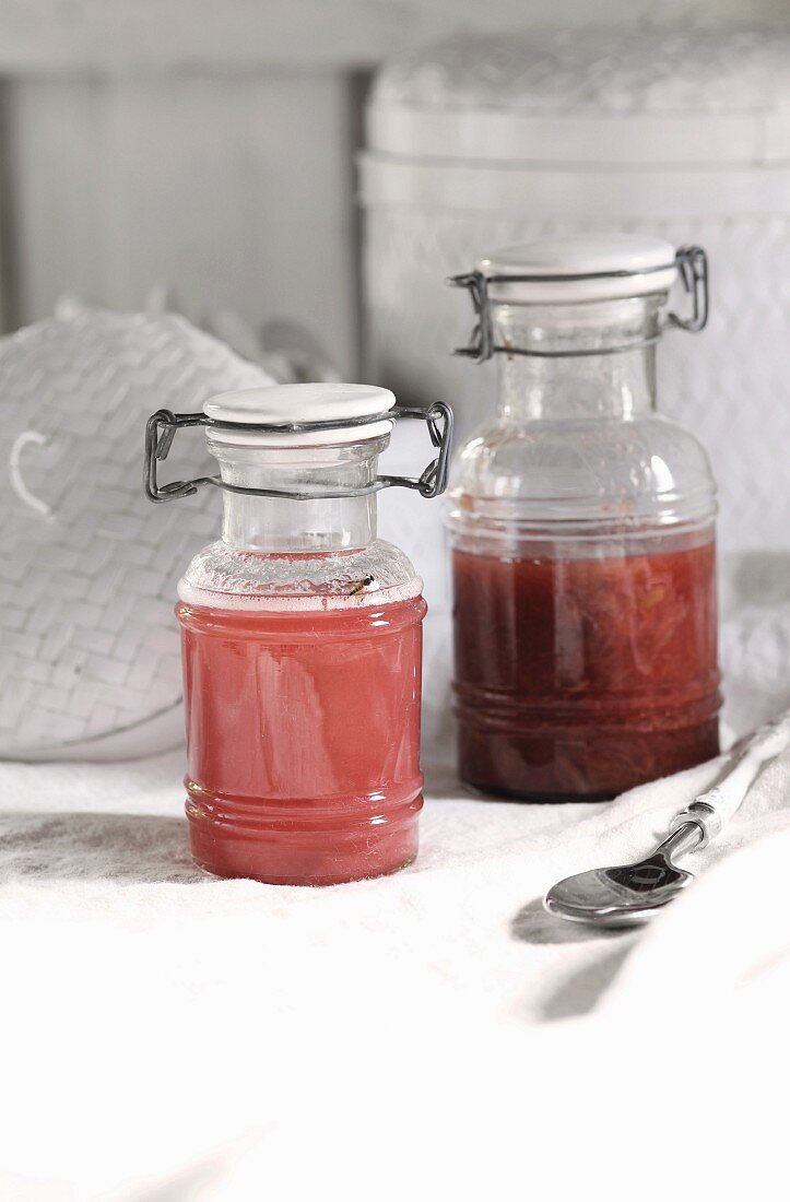 Rhubarb juice and rhubarb compote in glass containers
