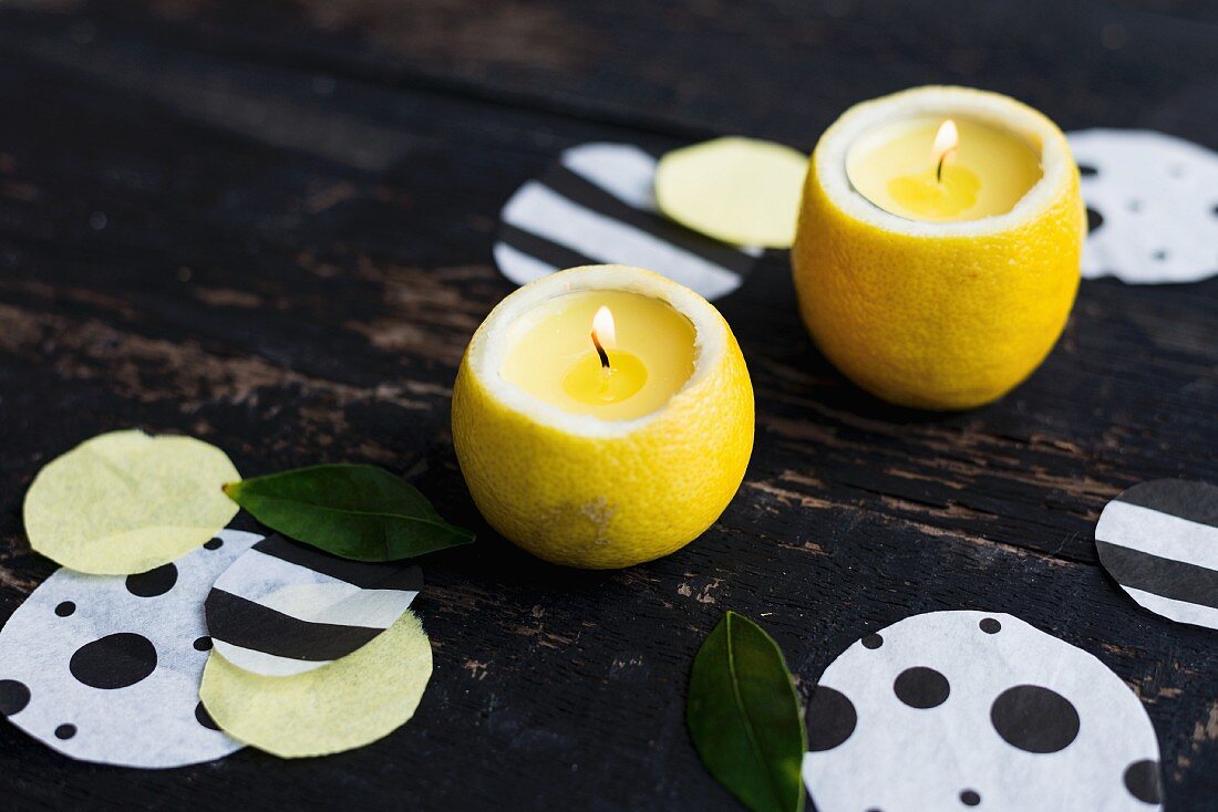 Selbstgemachte Zitronen-Kerzenhalter und Konfetti als Tischdeko