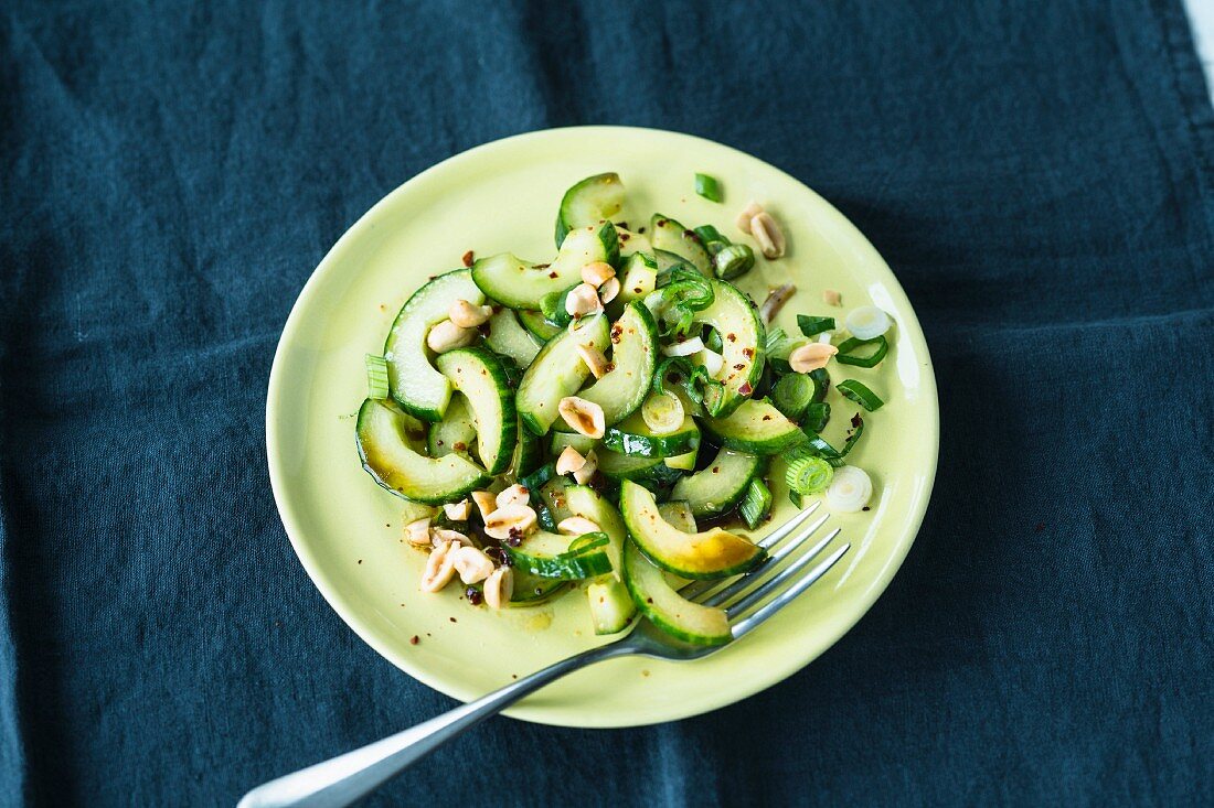 Cucumber salad with spring onions and peanuts (Asia)