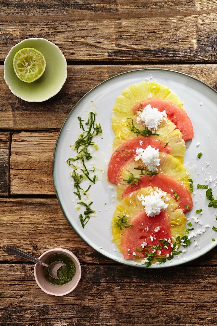Watermelon and pineapple carpaccio with grated coconut, lime and mint