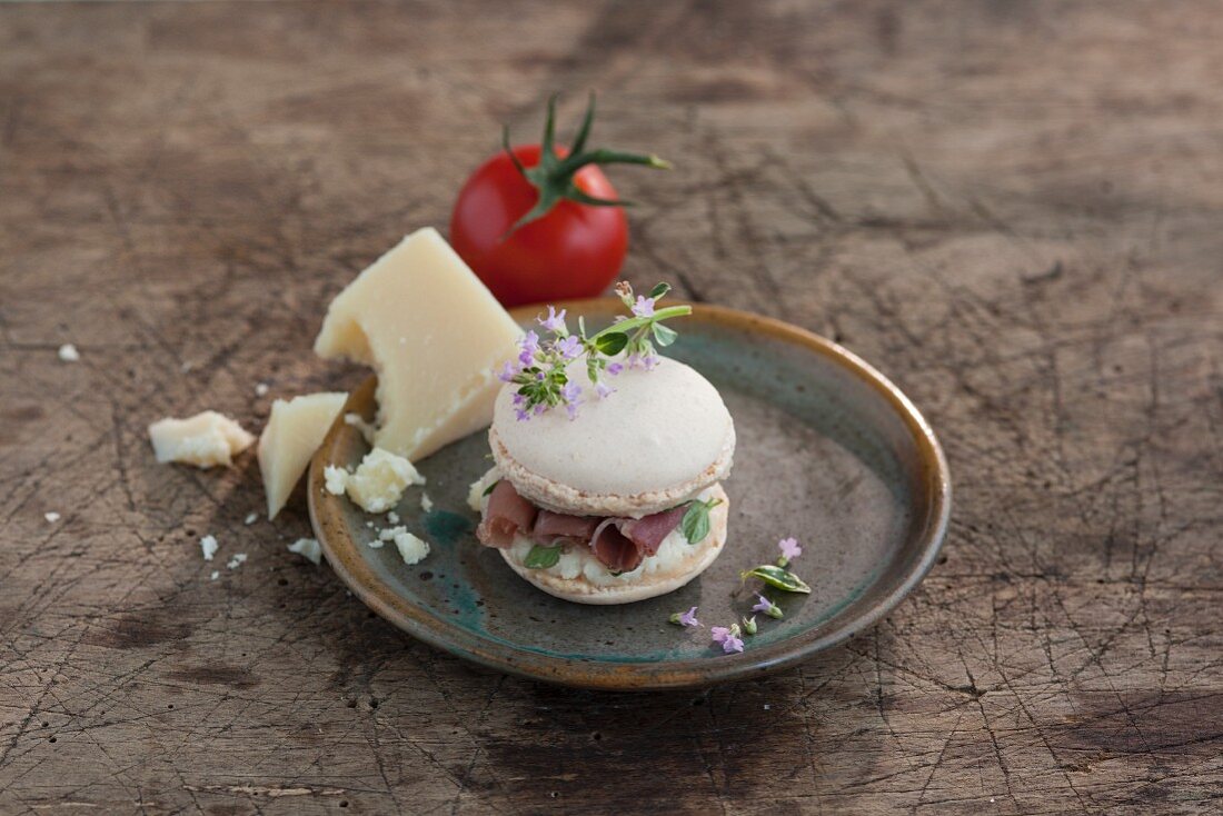 A macaroon with a savoury Parmesan and Parma ham filling