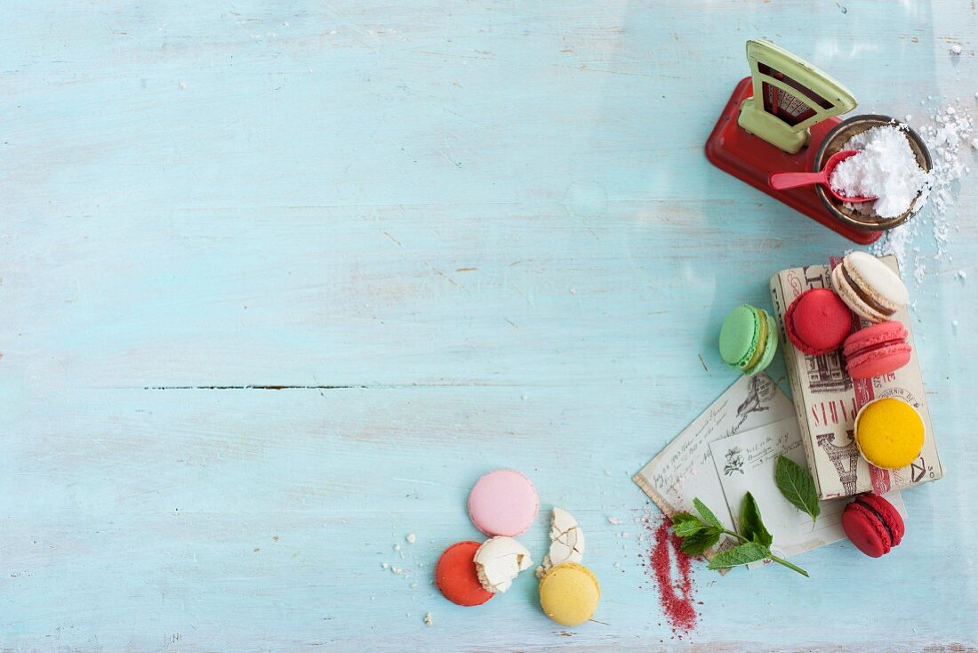 Various macaroons with a pair of toy scales