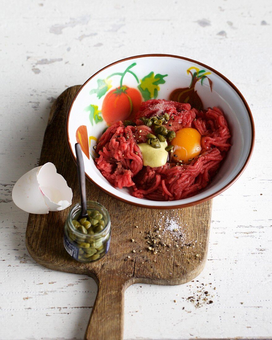 Beef tartare with an egg yolk and capers