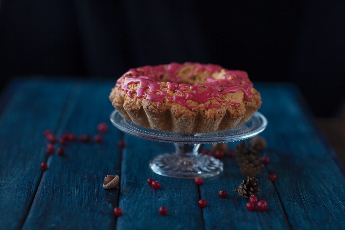 Gluten-free cranberry cake on a cake stand