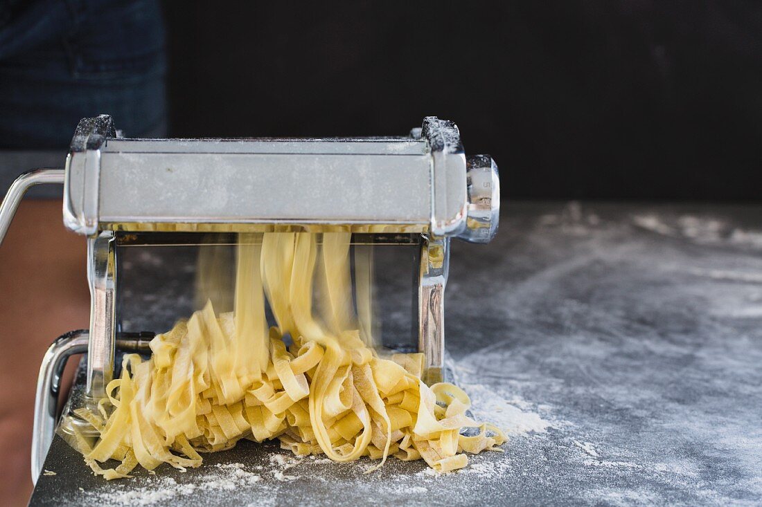 Homemade fresh tagliatelle with a pasta machine