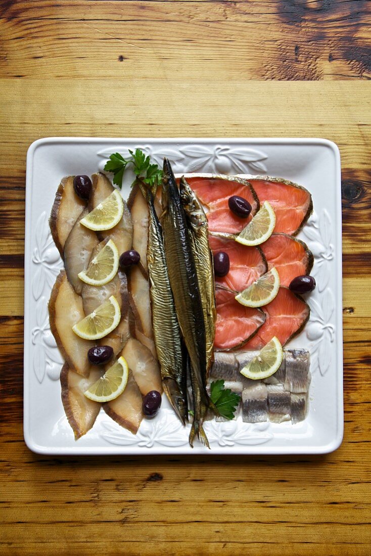 Cold fish platter with herring, salmon, whitefish and olives (Russia)