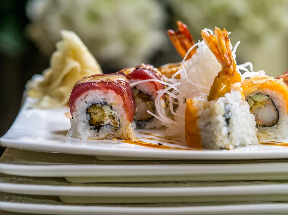 A sushi platter with fried rice noodles