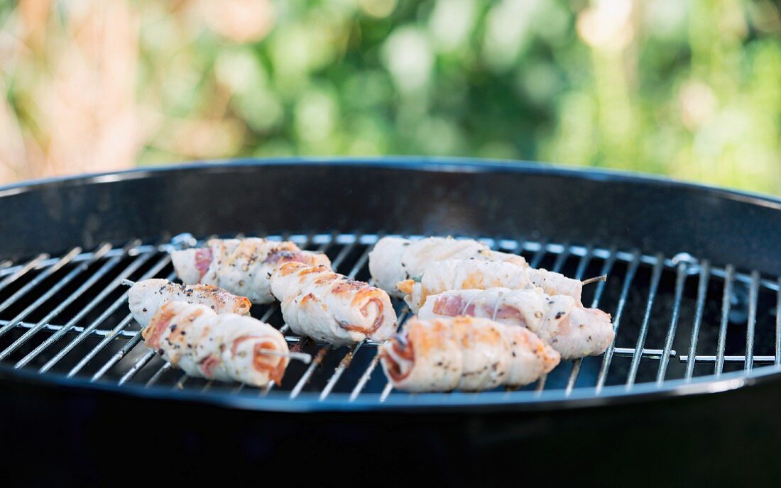 Chicken involtini with ham and sage on a barbecue