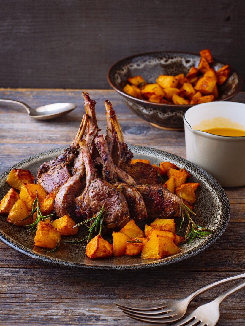 Lamb chops in orange sauce with baked potatoes