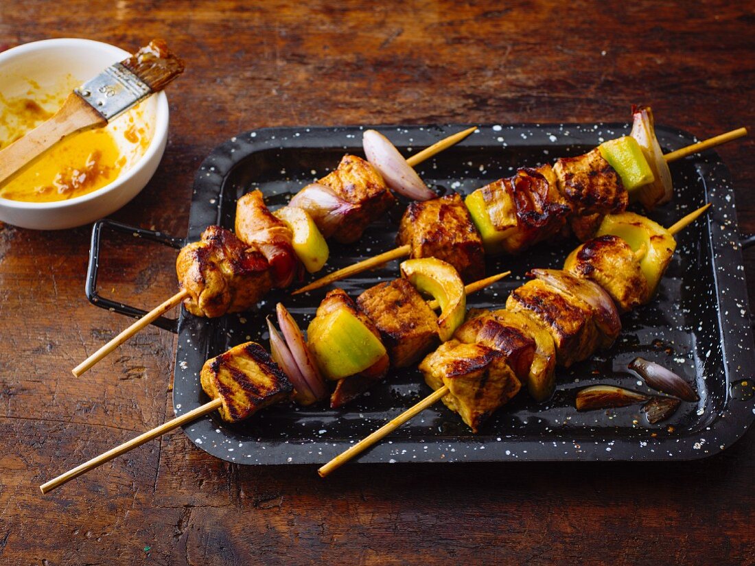 Exotic pork skewers with dried apricots and bacon