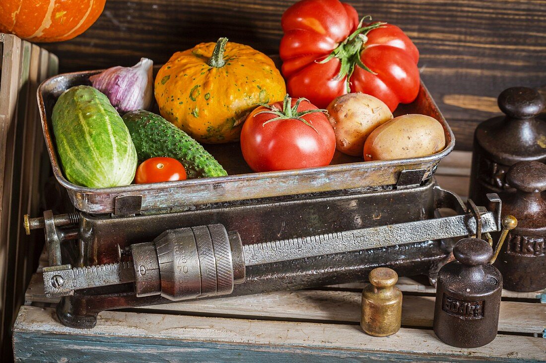 Various vegetables on an old pair of scales