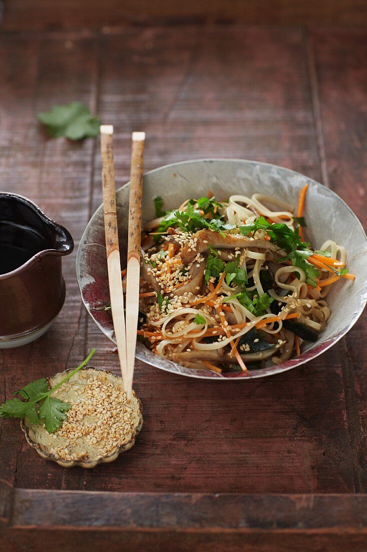 Oriental rice noodle and seaweed salad with sesame seeds and ginger dressing