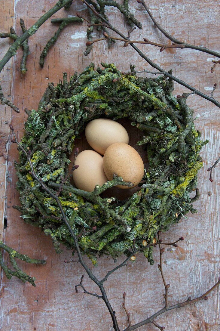 Hens' eggs in Easter nest of apple tree twigs