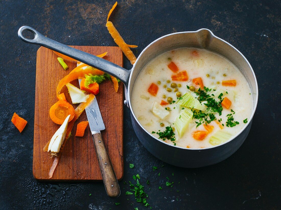 Roasted semolina soup with carrots and peas