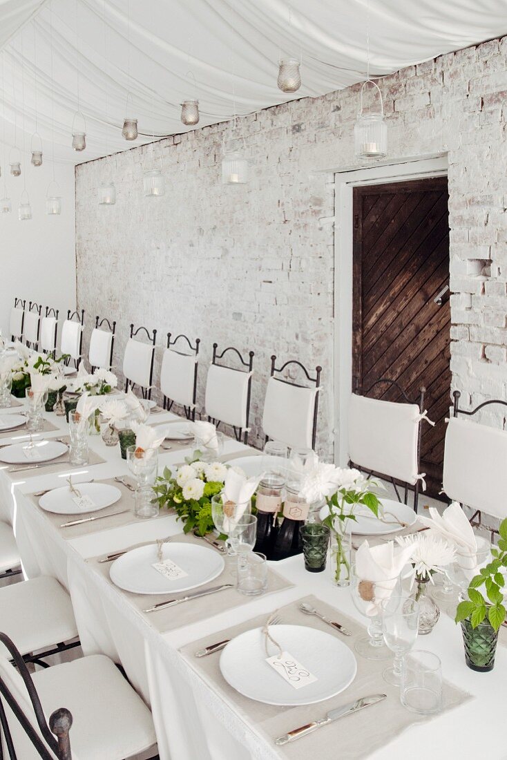 White wedding dinner table set in rustic style