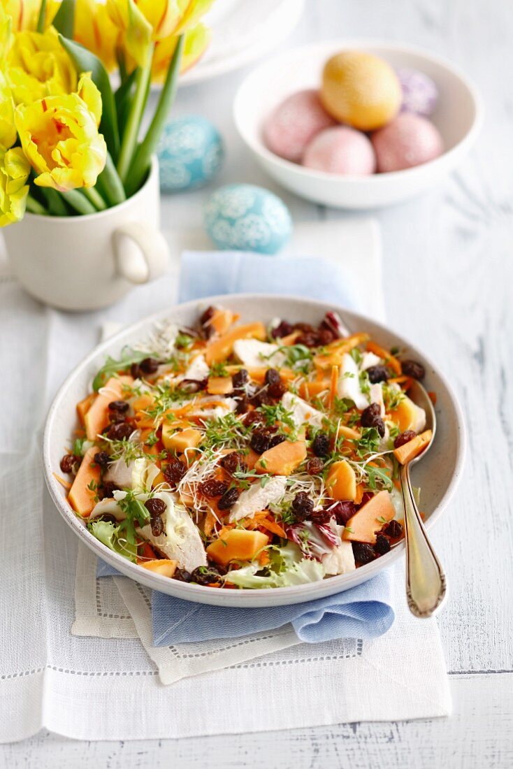 Papaya and chicken salad with raisins, beansprouts and carrots for Easter