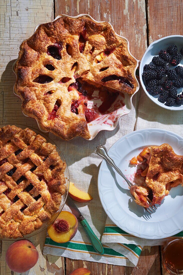 Peach and berry pie with blackberries, raspberries, and apricot jam