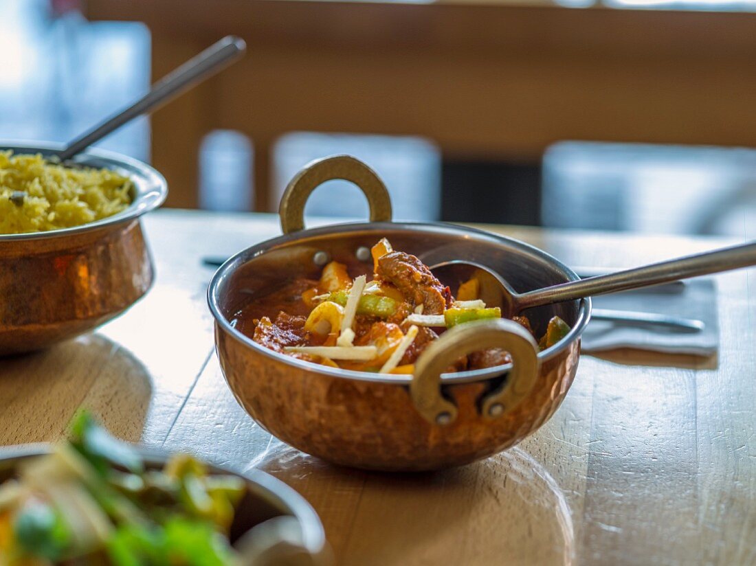 Lamb curry with peppers and rice in a restaurant