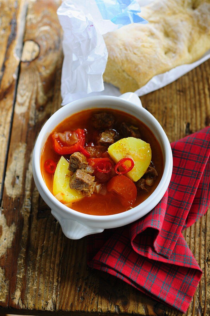 Goulash soup with peppers, chilli and potatoes