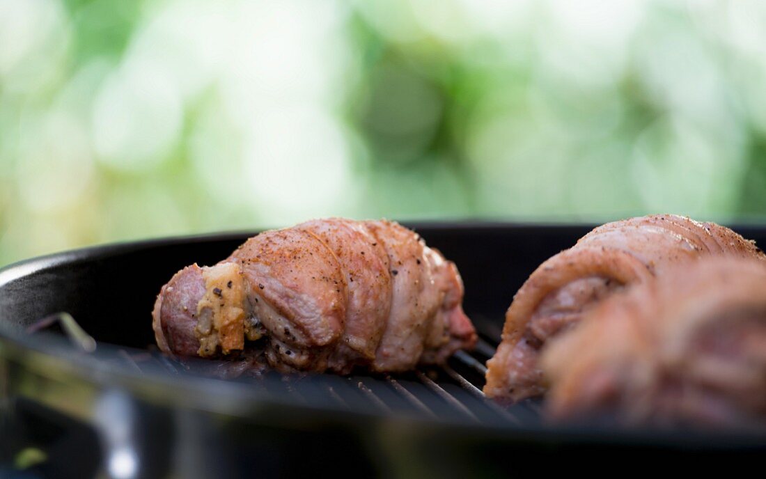 Stuffed turkey legs on a barbecue