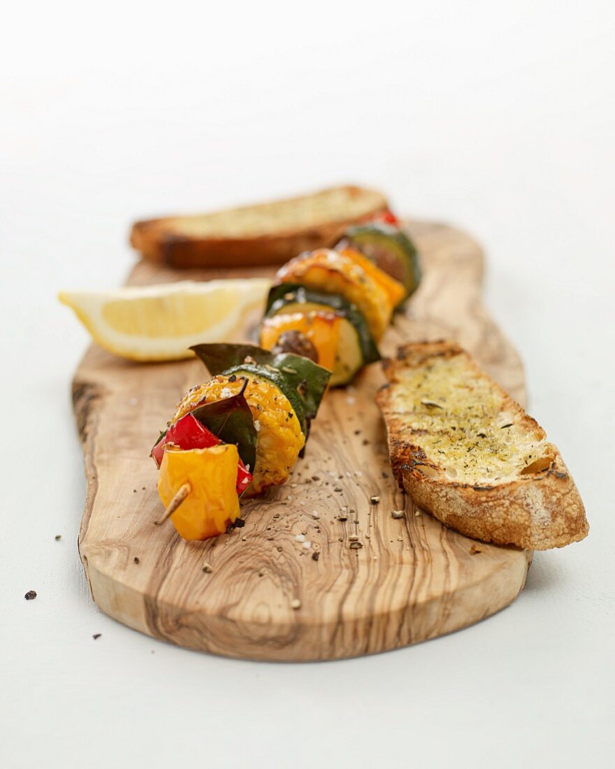 Grilled Mediterranean vegetable skewers with garlic bread