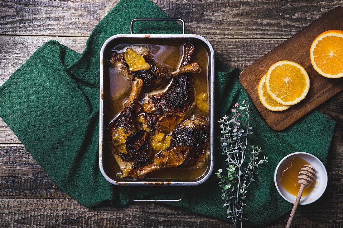 Duck legs with oranges, cranberries and honey