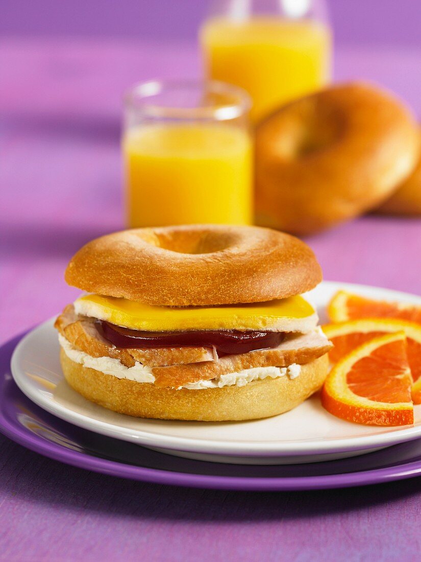 A bagel with turkey and cranberry jam