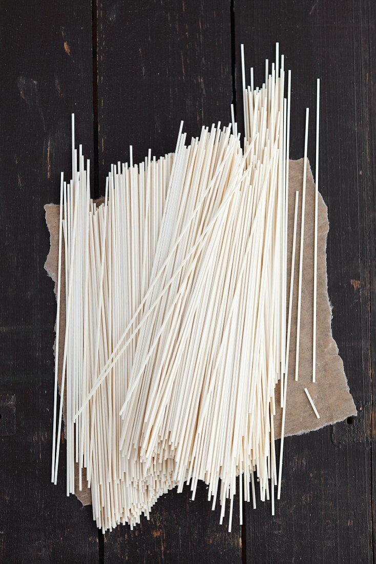 Shanghai noodles on a dark grey wooden table