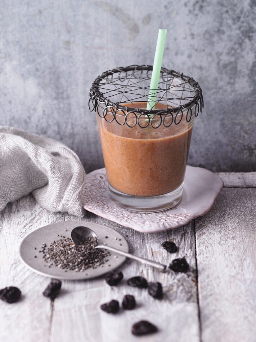 An apple and cherry smoothie with chia seeds and lucuma powder