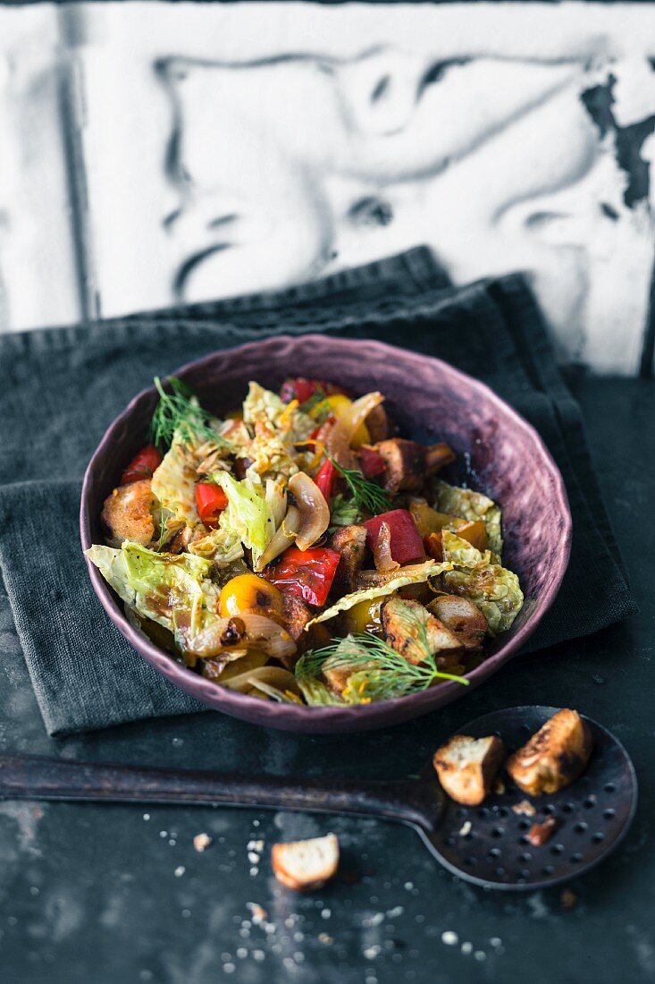 Savoy pretzel salad with peppers and harissa