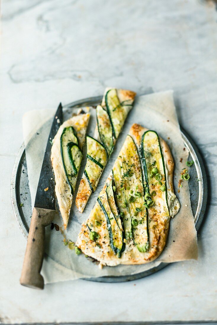 Tarte flambée with courgette, goat's cheese and salted lemons